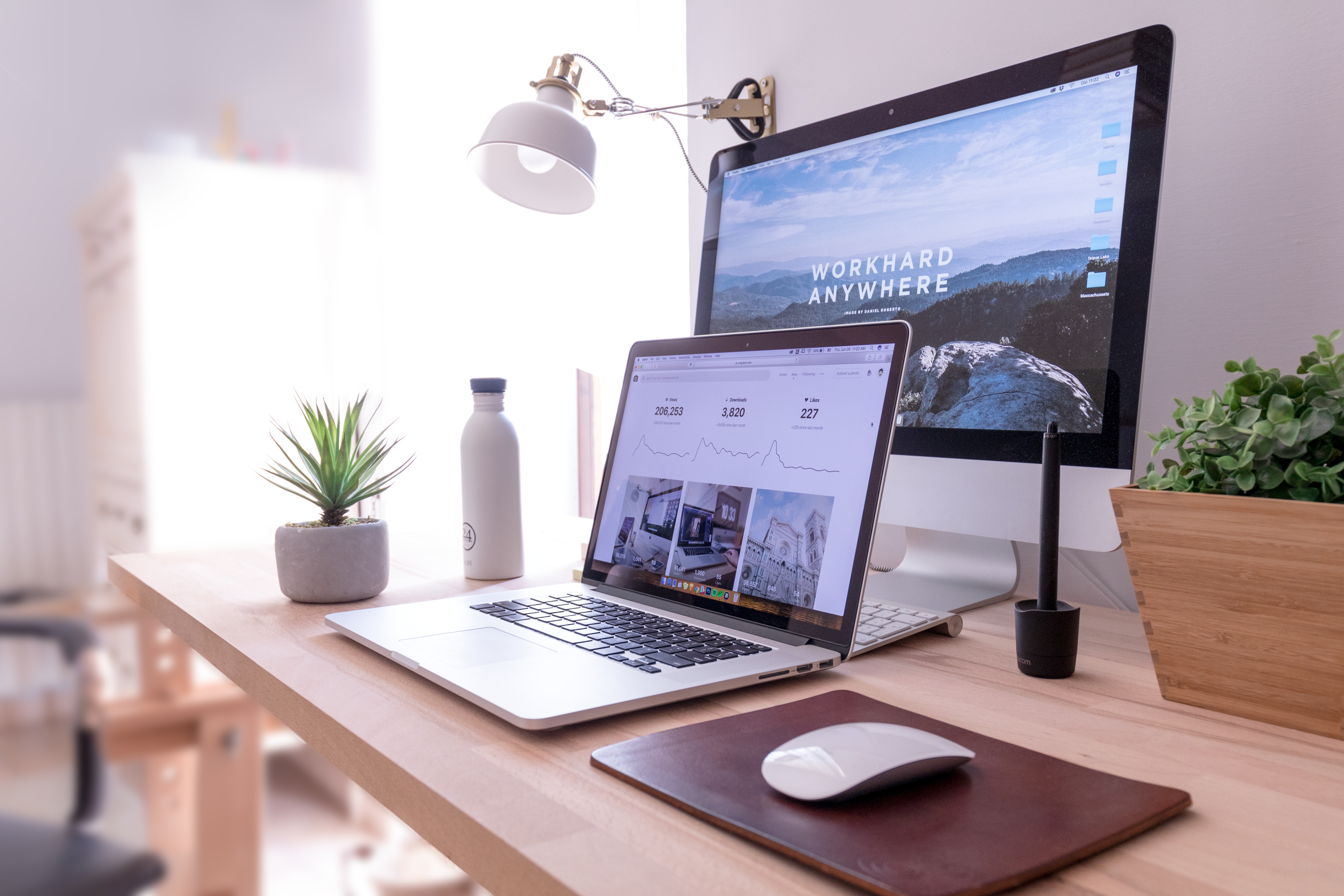 Photo of a laptop computer with a second monitor in a modern home office.