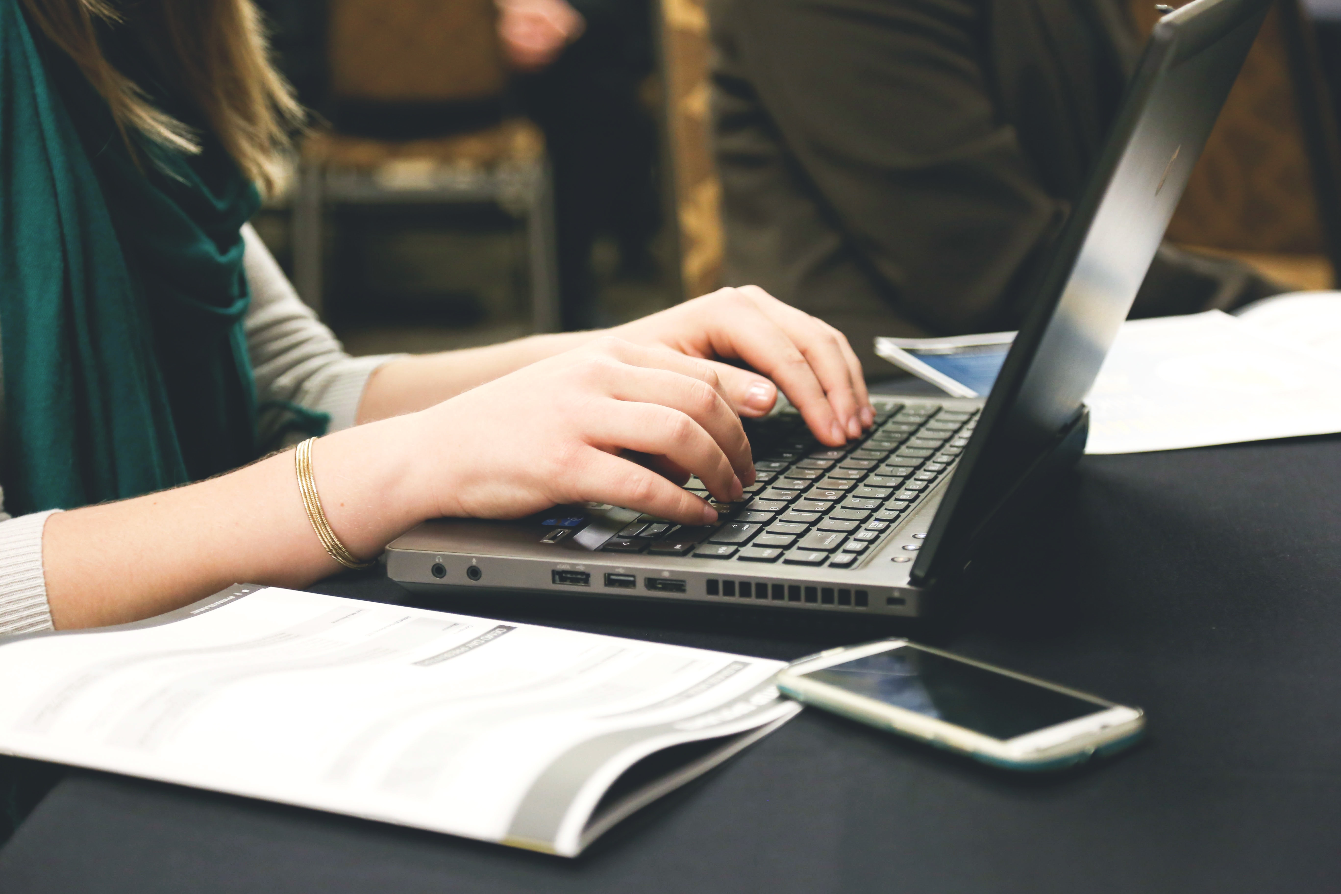 Photo of a woman working Magazine Writing Job on laptop