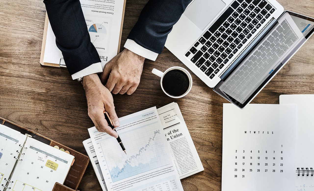 Photo of a businessman reviewing financial info.